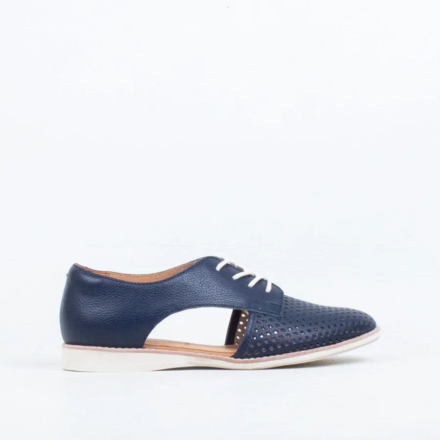 sidecut_punch_16.webp Lace Up^Rollie Sidecut Punch